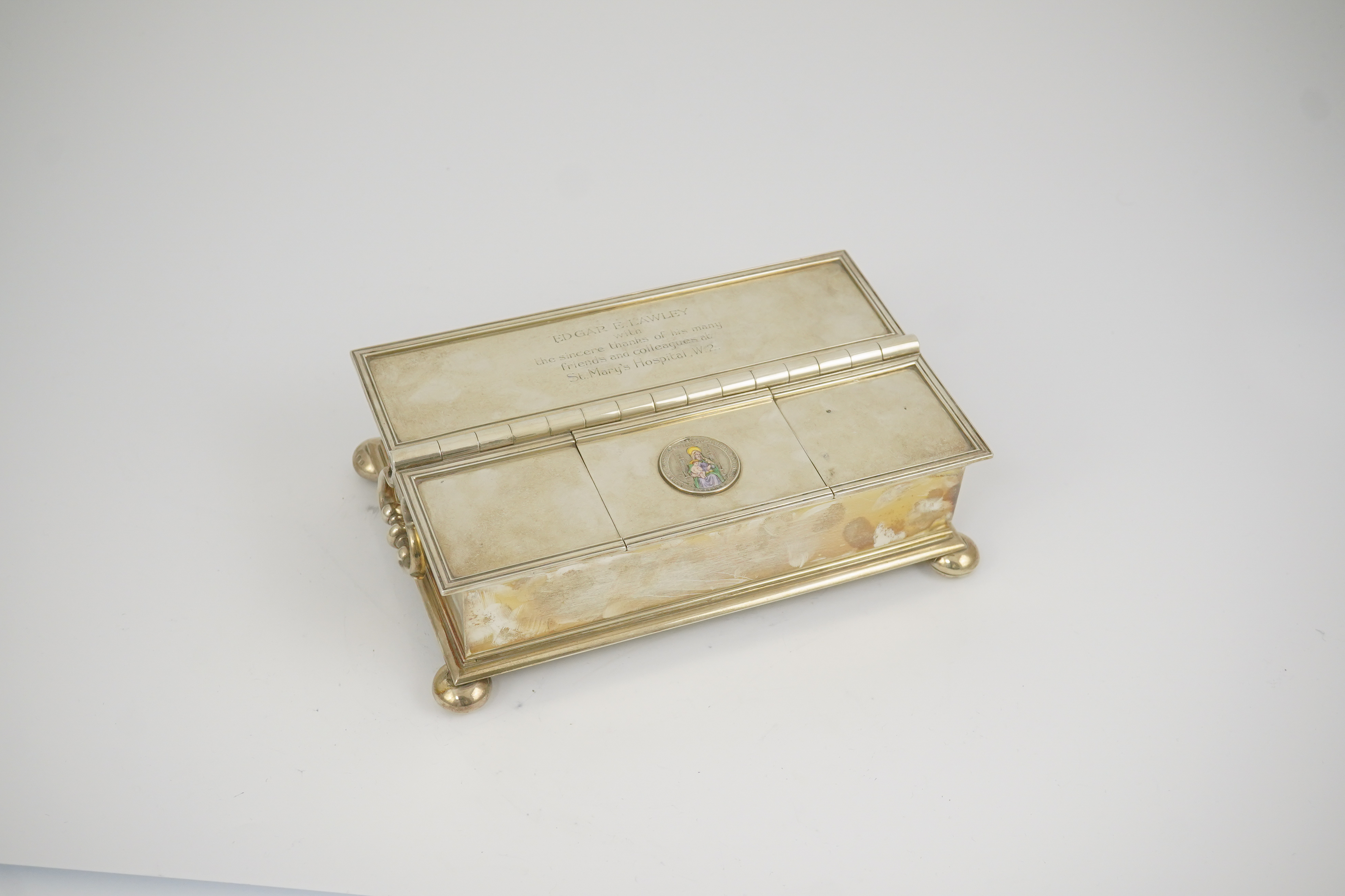 A George V Britannia standard silver and enamel combination ‘treasury inkstand/ cigarette box, by Crichton Brothers